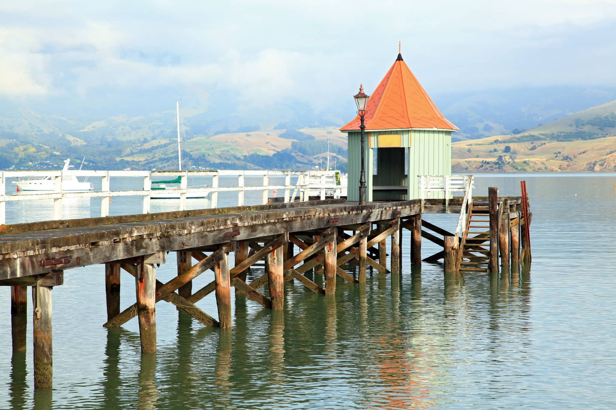 motor boat jetty pier building on lake at Akaroa New Zealand