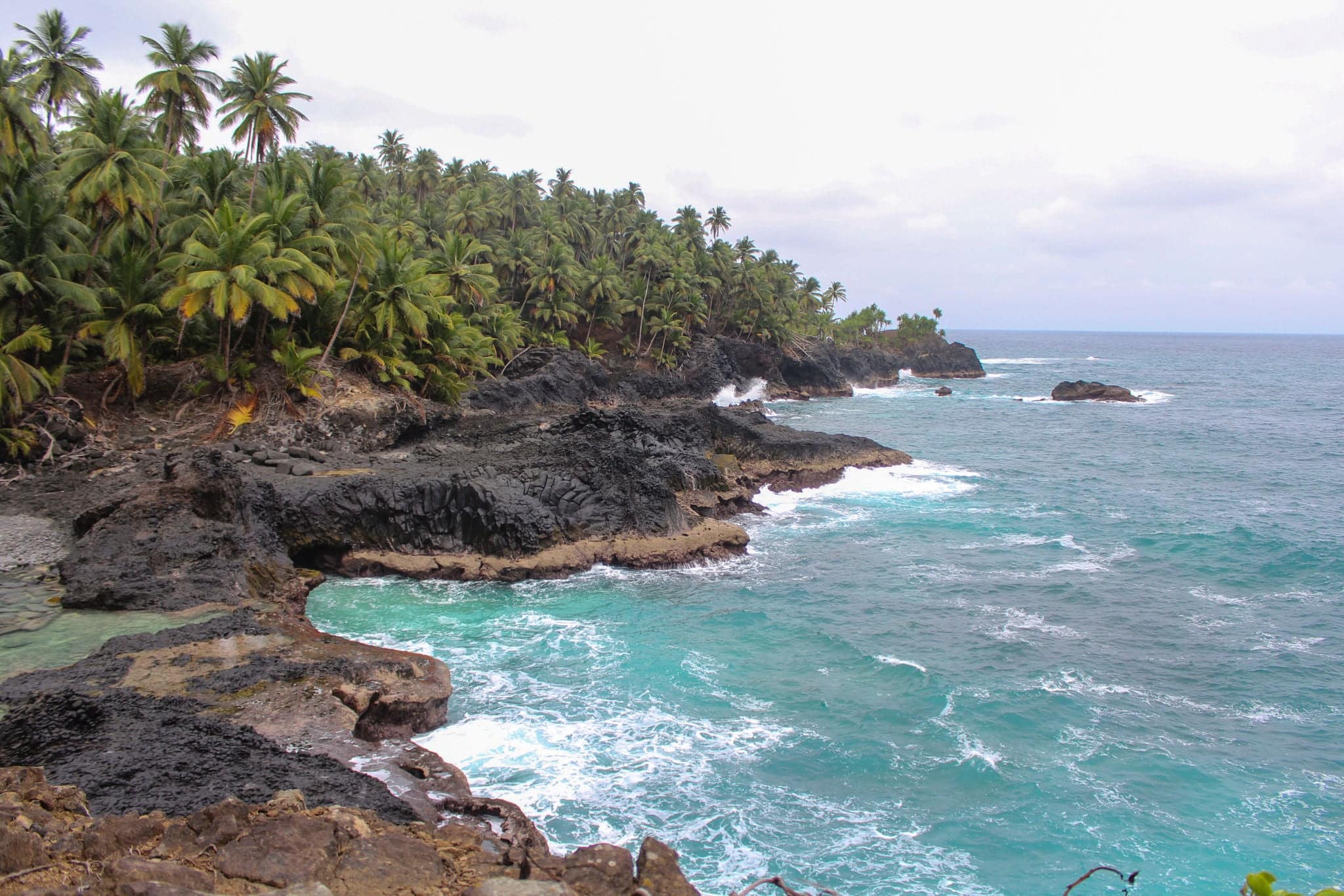 Beautiful beach with volcanic rocks and clear water in Sao Tome and Principe Island, in Africa