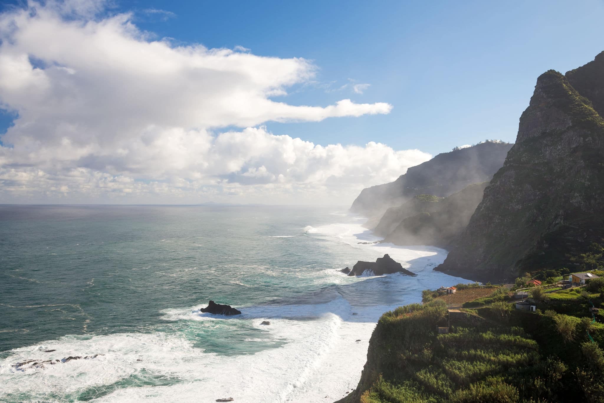 Steep coast with beautiful blue ocean and sky, Ponta Delgada, Madeira, Portugal