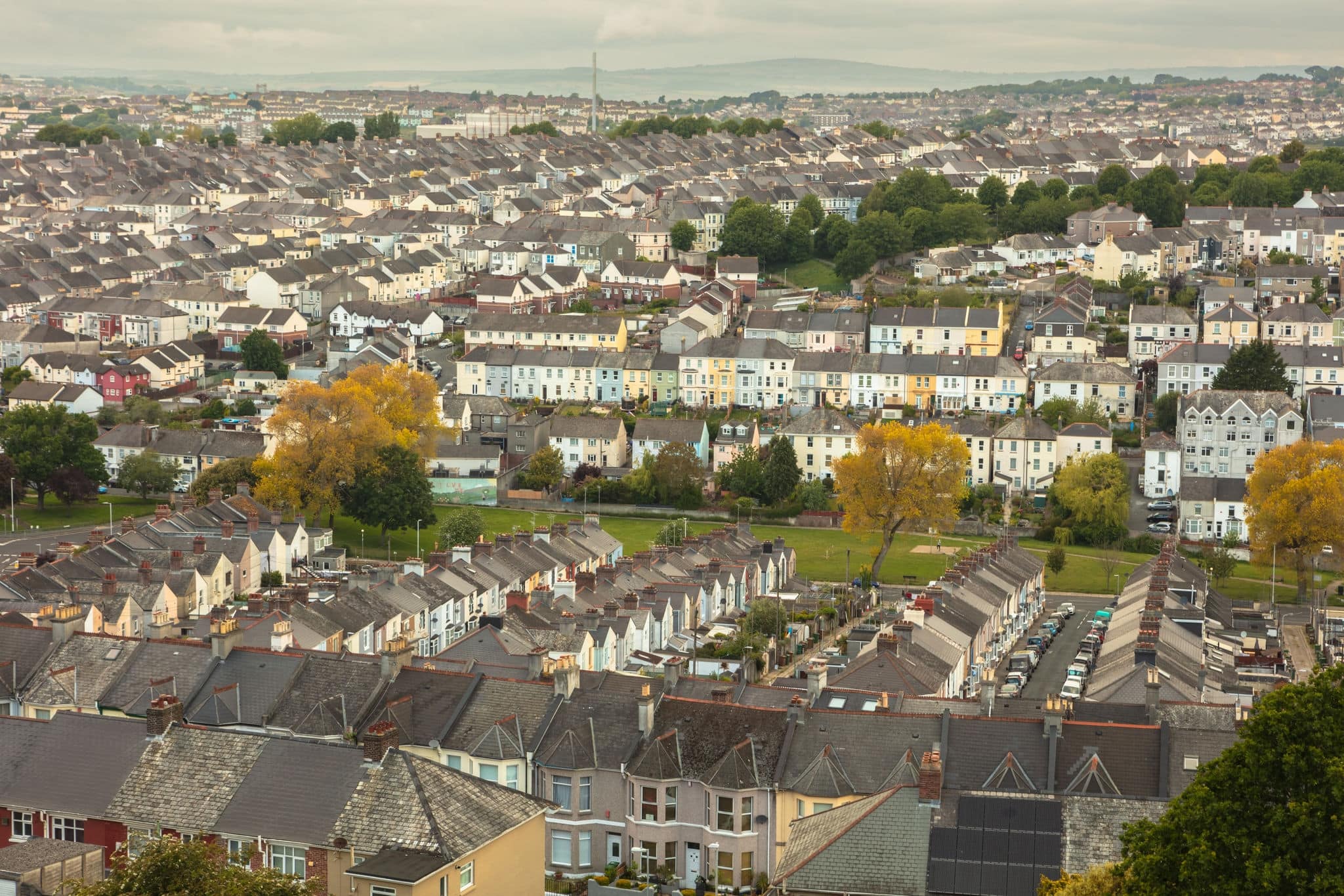 View for miles over the townhouse and terraced housing of Plymouth, Devon, England, UK. Deprived area, social housing, urban