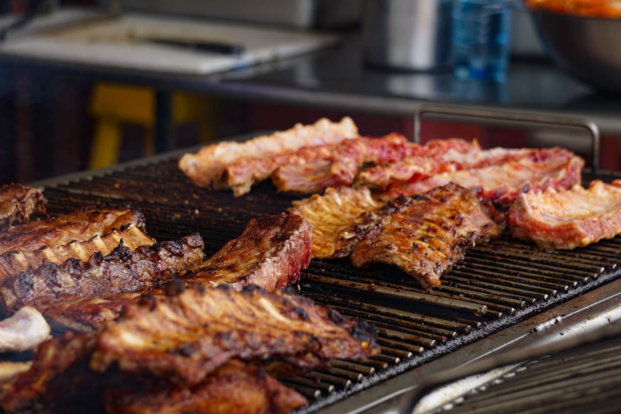 BBQ Ribs cooking on a grill by the road side on St. Maarten Island.