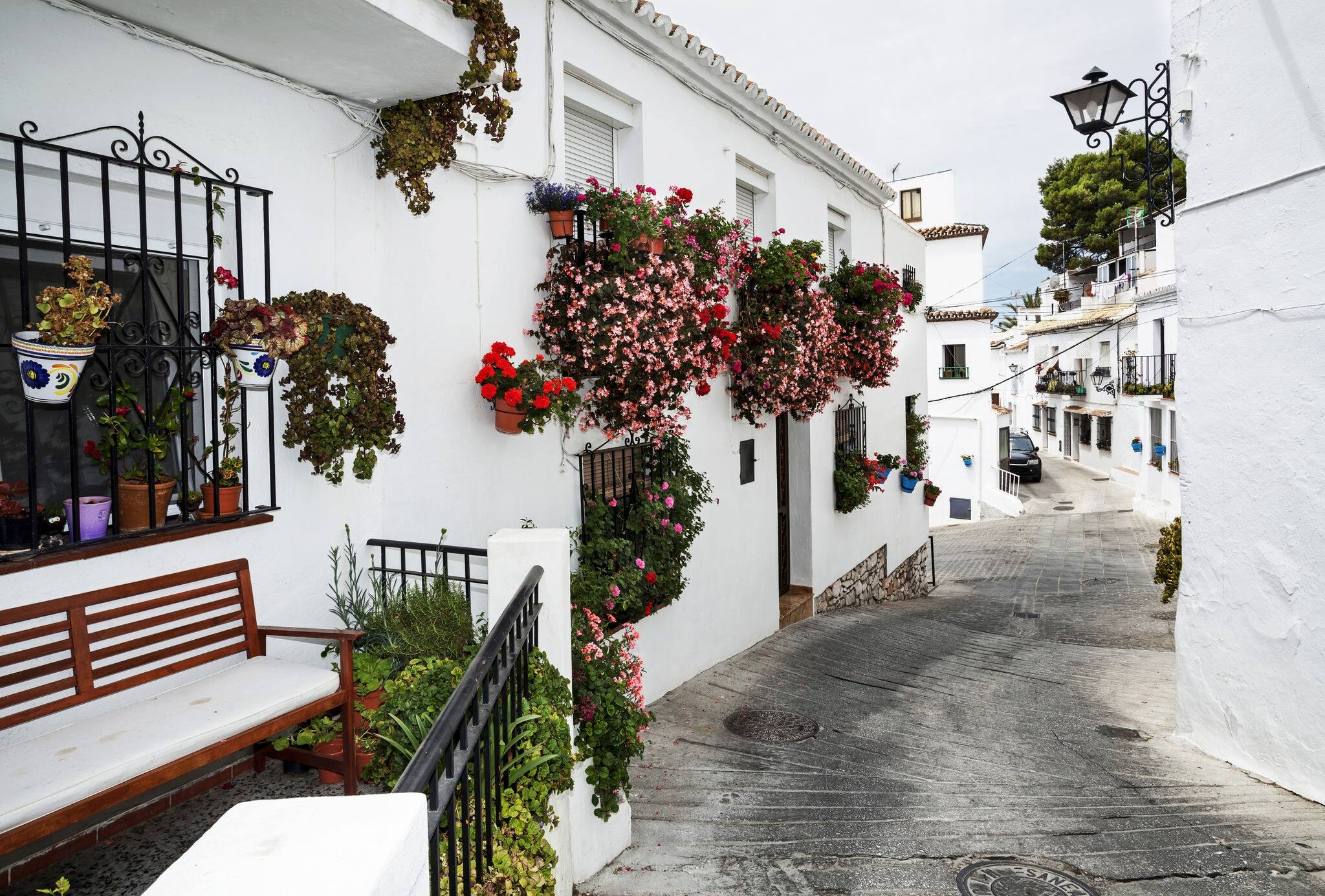 Street with flowers in the Mijas town, Spain 
