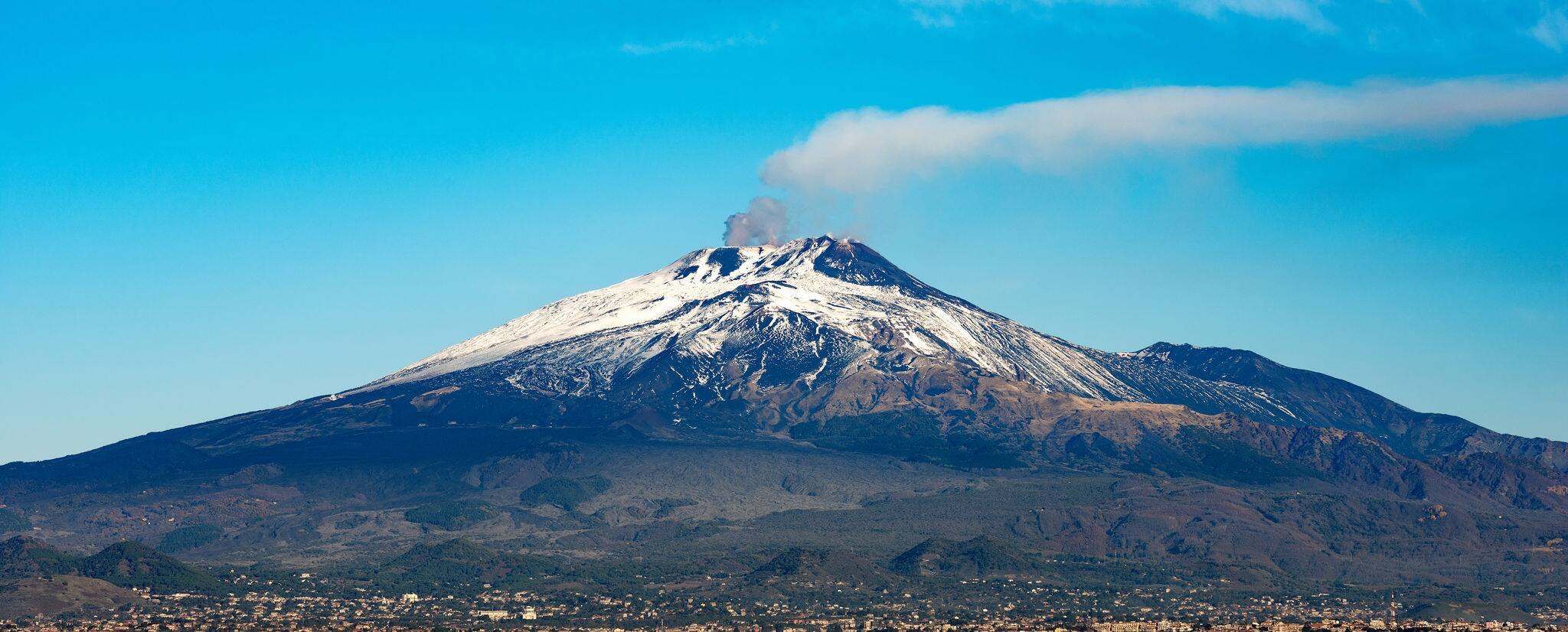 The mount Etna Volcano with smoke and Silvestri craters in the Catania city, Sicily island, Italy (Sicilia, Italia) Europe