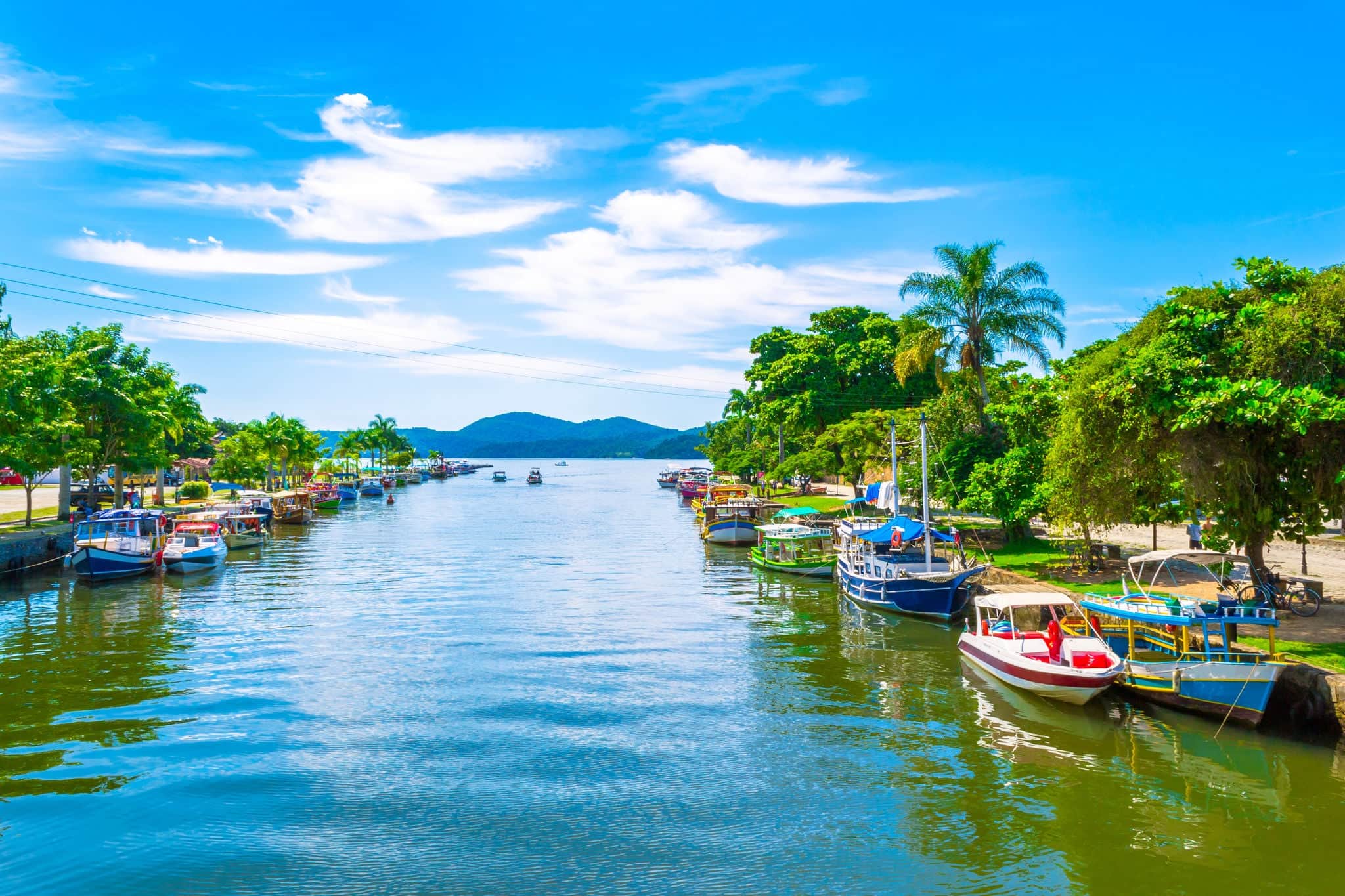View of the canal and boats of the historic town Paraty, Rio de Janeiro state, Brazil. Sunny day in Paraty. Paraty is the colonial city listed Unesco