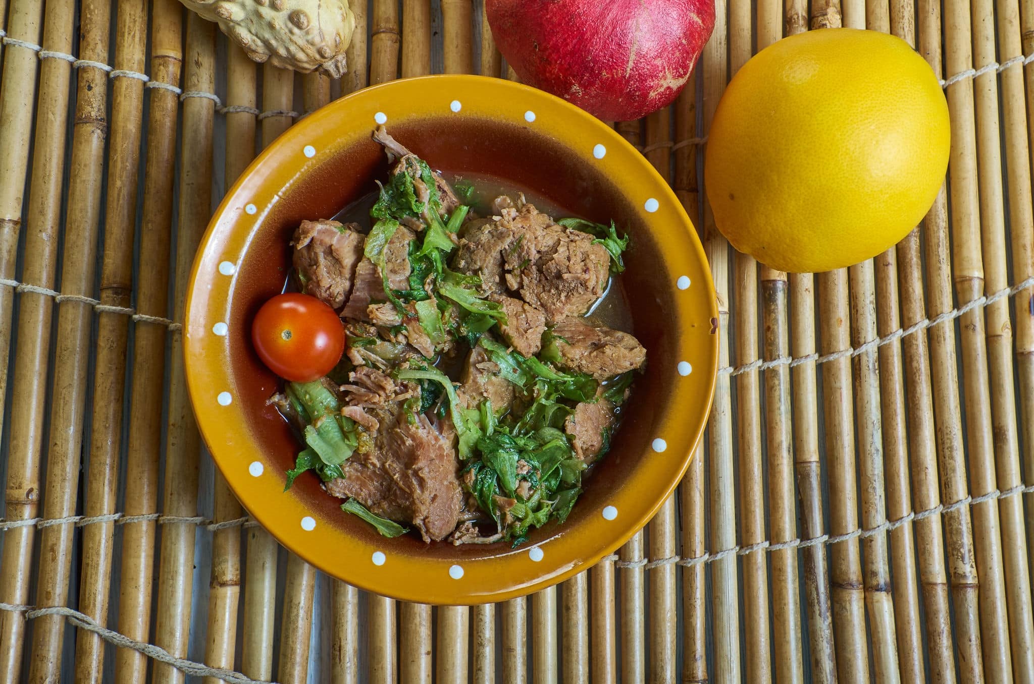 Romazava - national dish of Madagascar, consisting of greens, zebu meat, tomatoes, and onions, combination of green leafy vegetables
