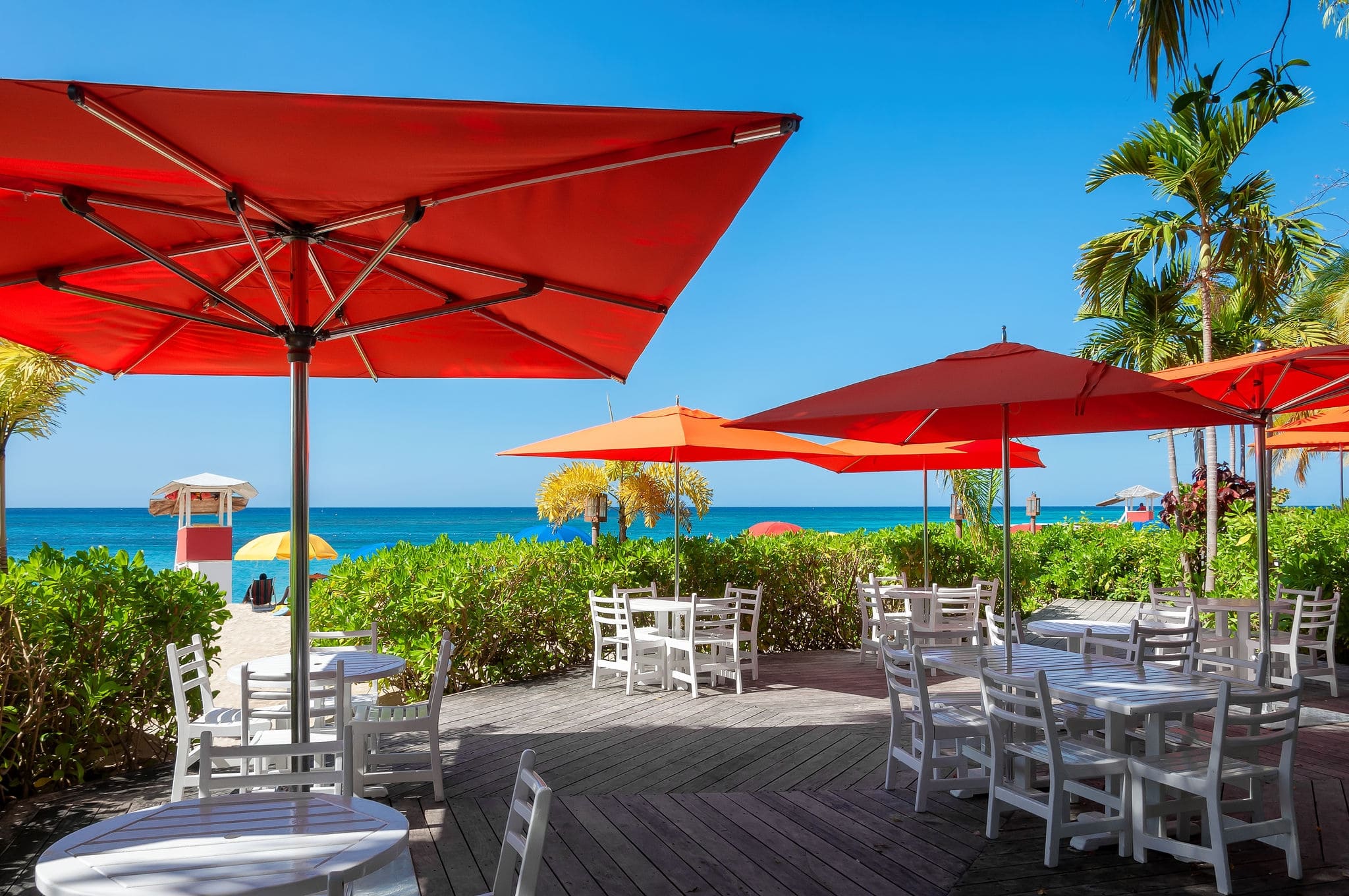 Beach cafe with umbrellas in Caribbean island in Montego bay, Jamaica