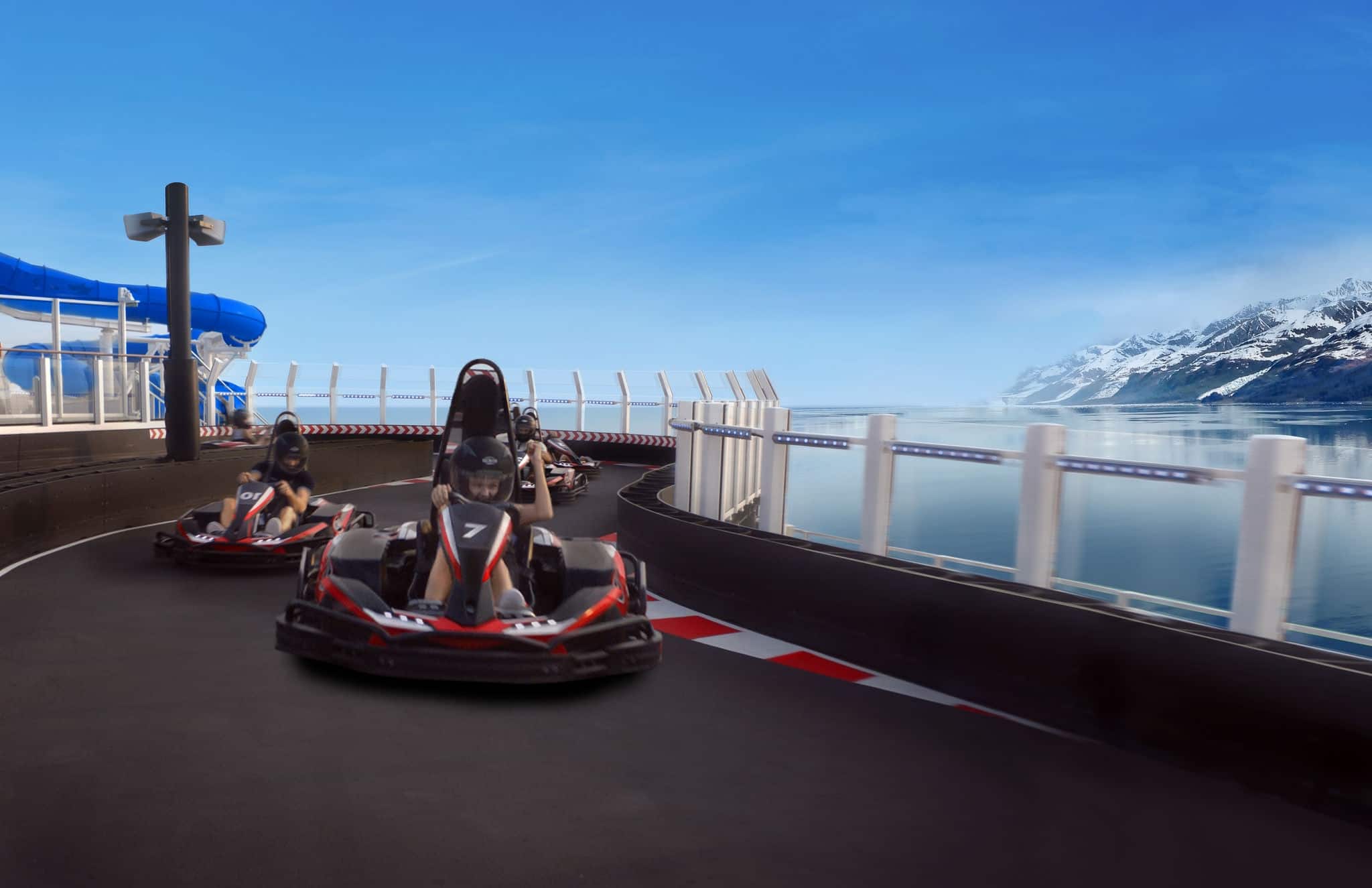 people racing go karts on a track on top of a cruise ship