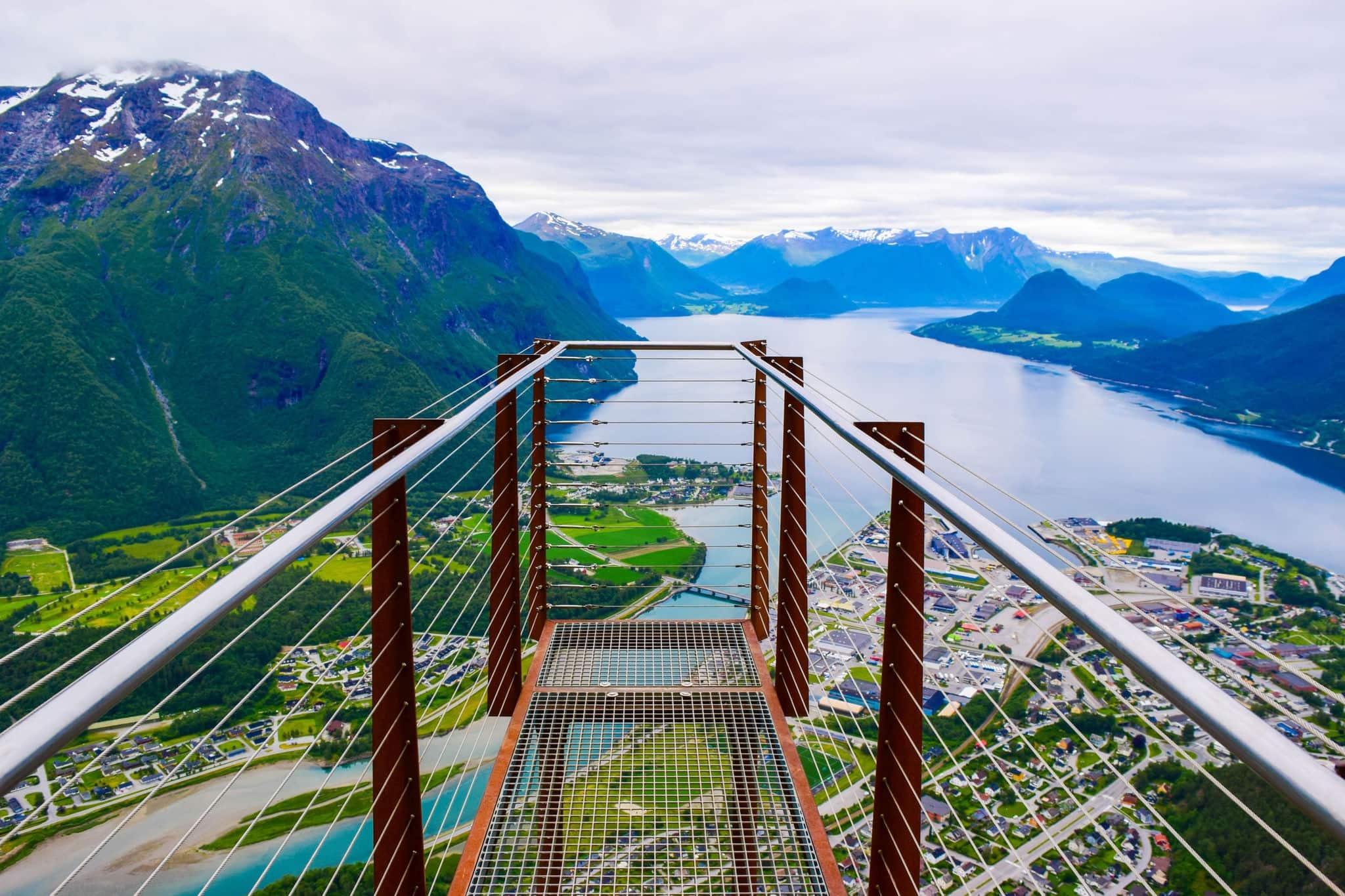 Rampestreken viewpoint. Panoramic nobody landscape to Romsdalen Valley and Andalsnes city located on shores of Romsdalsfjord (Romsdal Fjord), between picturesque mountains. Rauma Municipality, Norway.