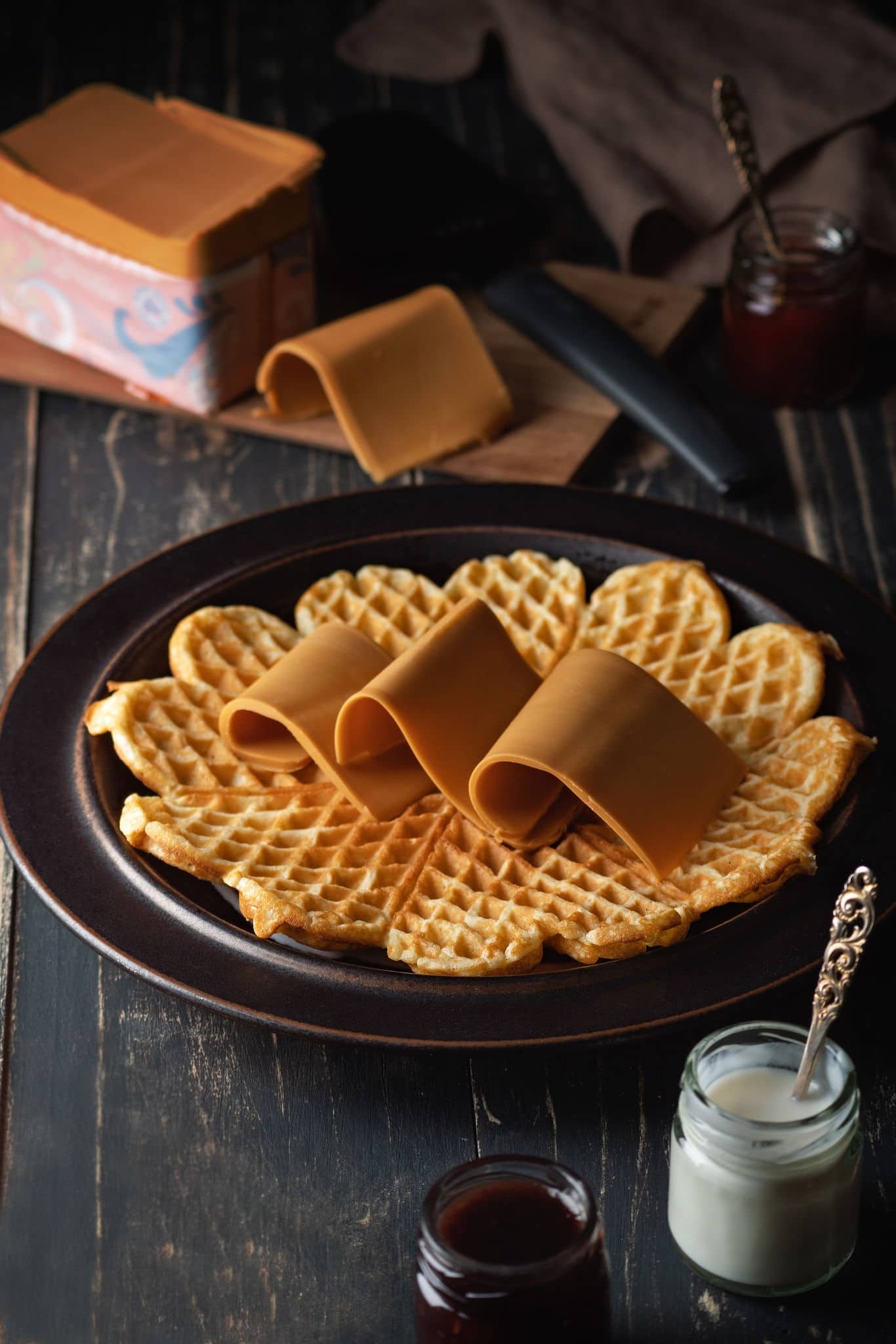 Homemade heart-shaped waffles with brown cheese(brunost). Norwegian (Scandinavian) waffles