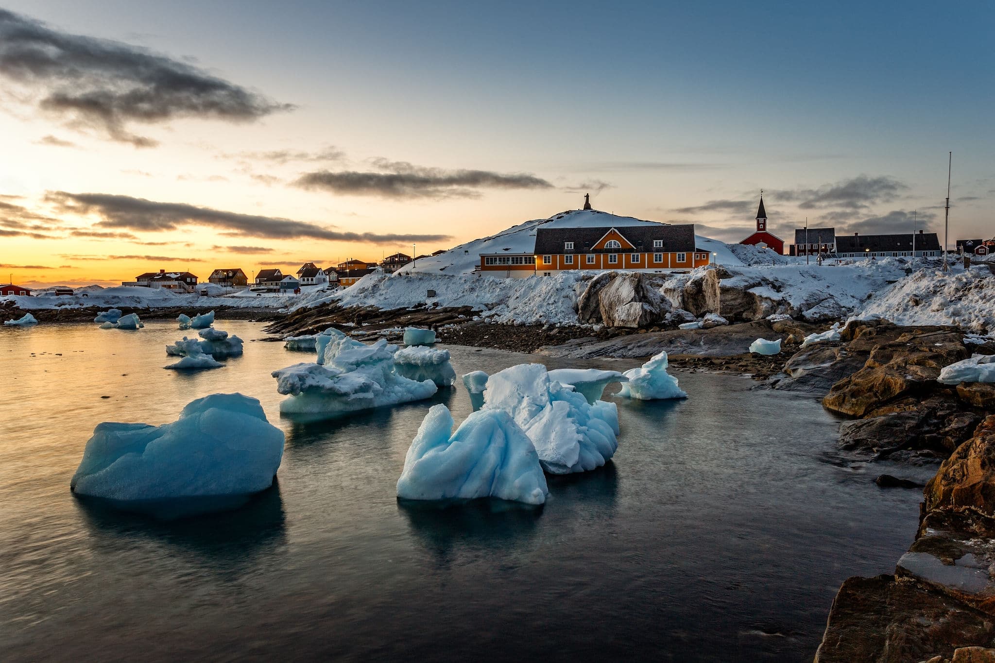 Nuuk city old harbor sunset view with icebergs, Greenland
