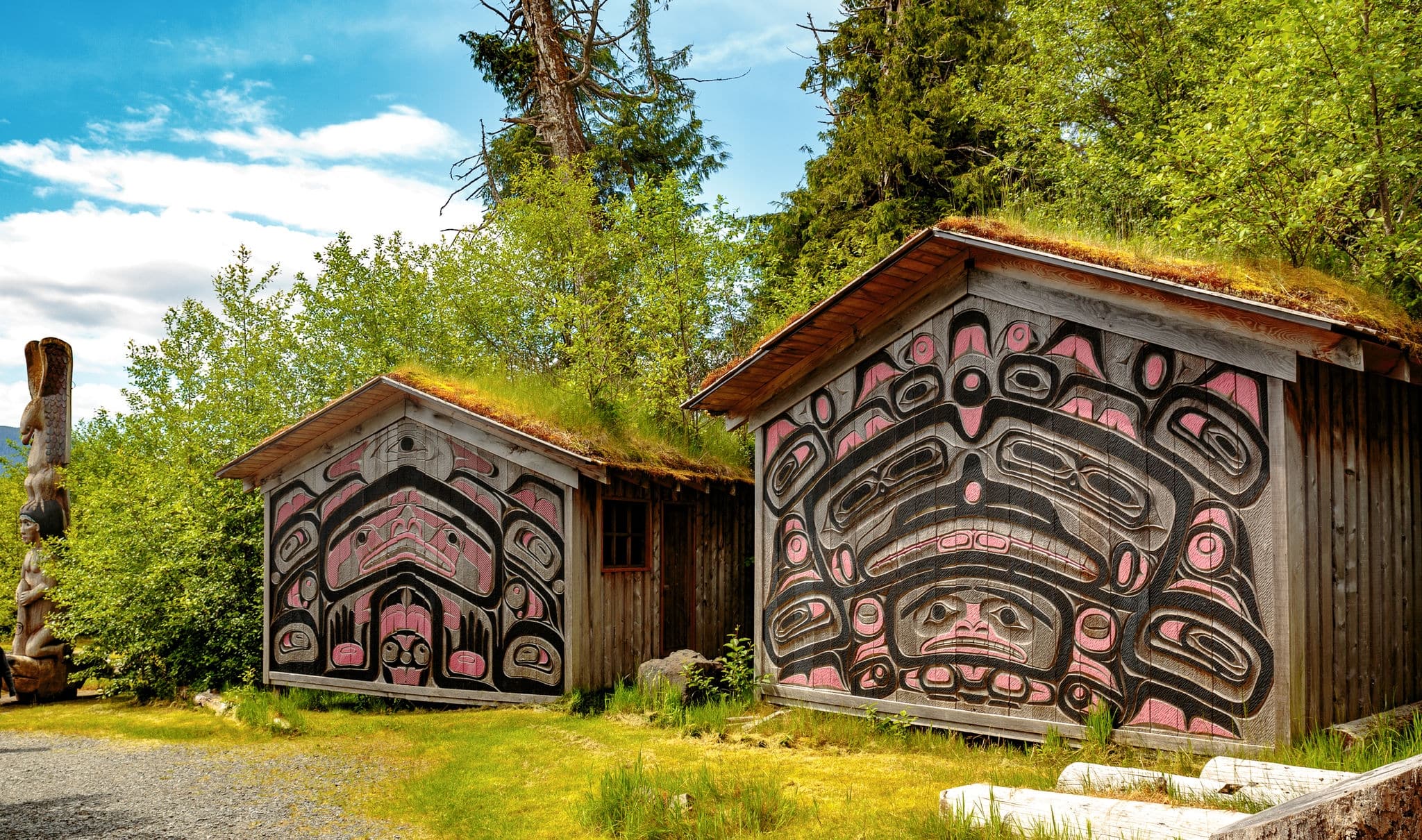 Ketchikan, AK, USA - May 24, 2016:  Native American Totems and Clan Houses located at Totem Bight State Historic Site.