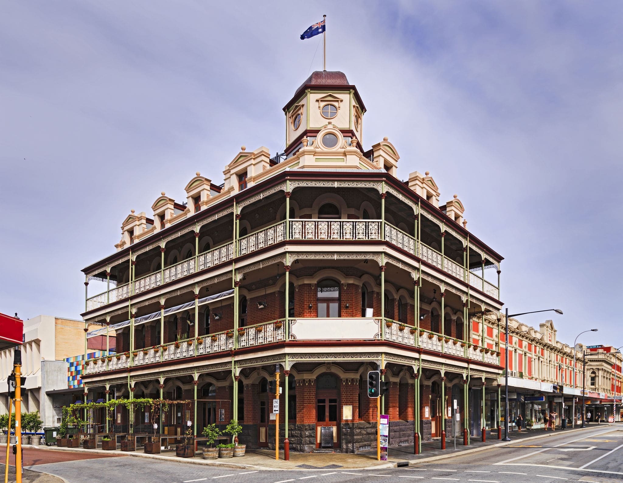 Historic buildings in the centre of Fremantle town near Perth of Western Australia. Corner of town streets with accommodation and pub and patrons.