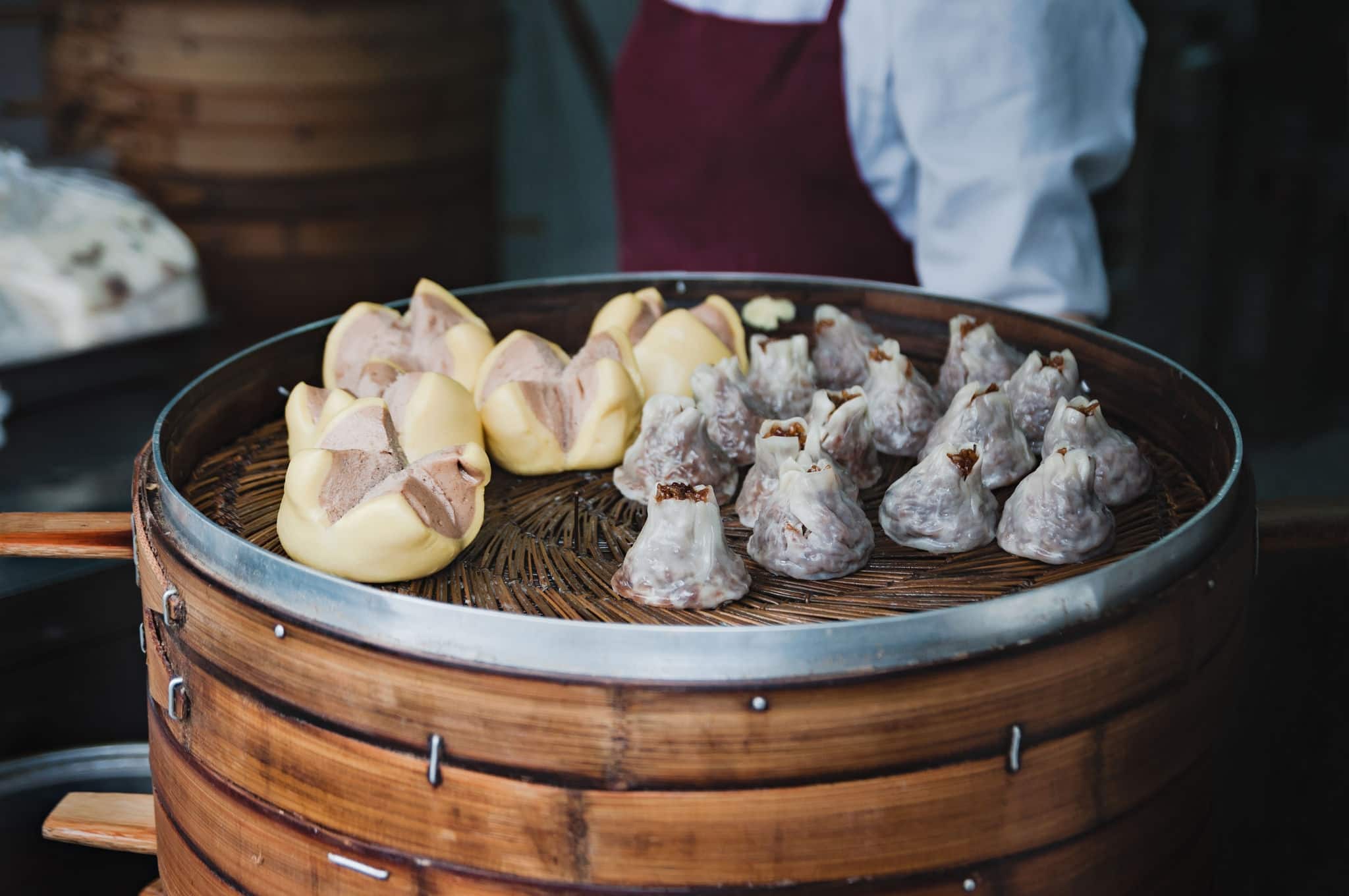 Chinese dumplings or xiao long bao in bamboo tray, famous food in Shanghai, China.Street Food