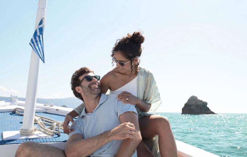 Couple on boat in Greece. 
