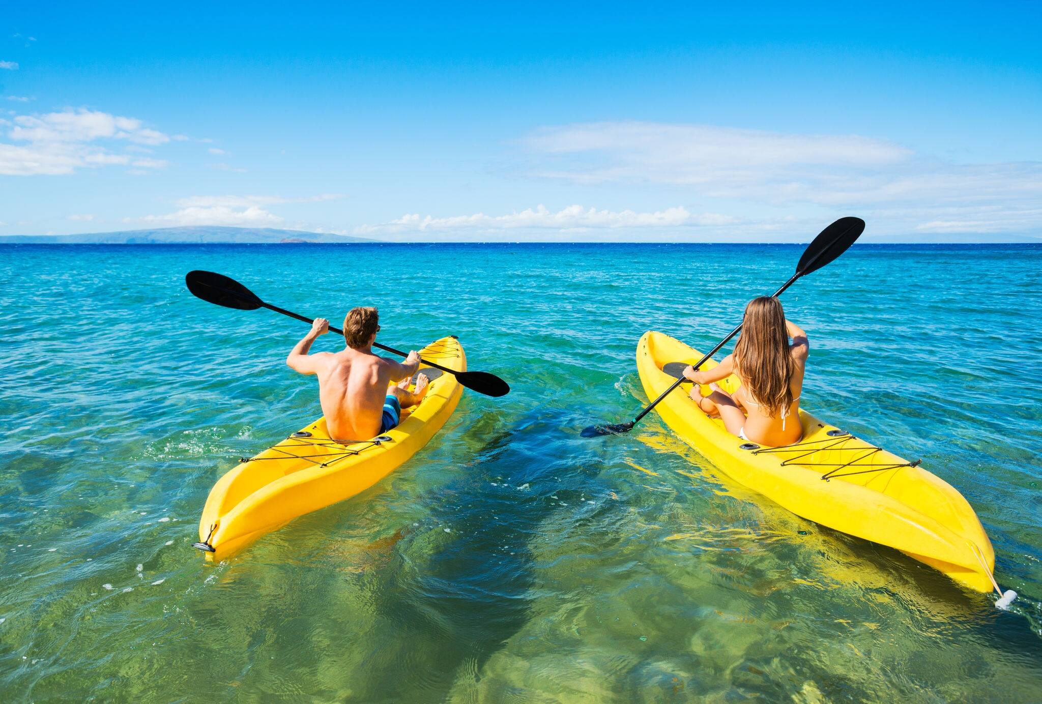 Couple Kayaking in the Ocean on Vacation 
