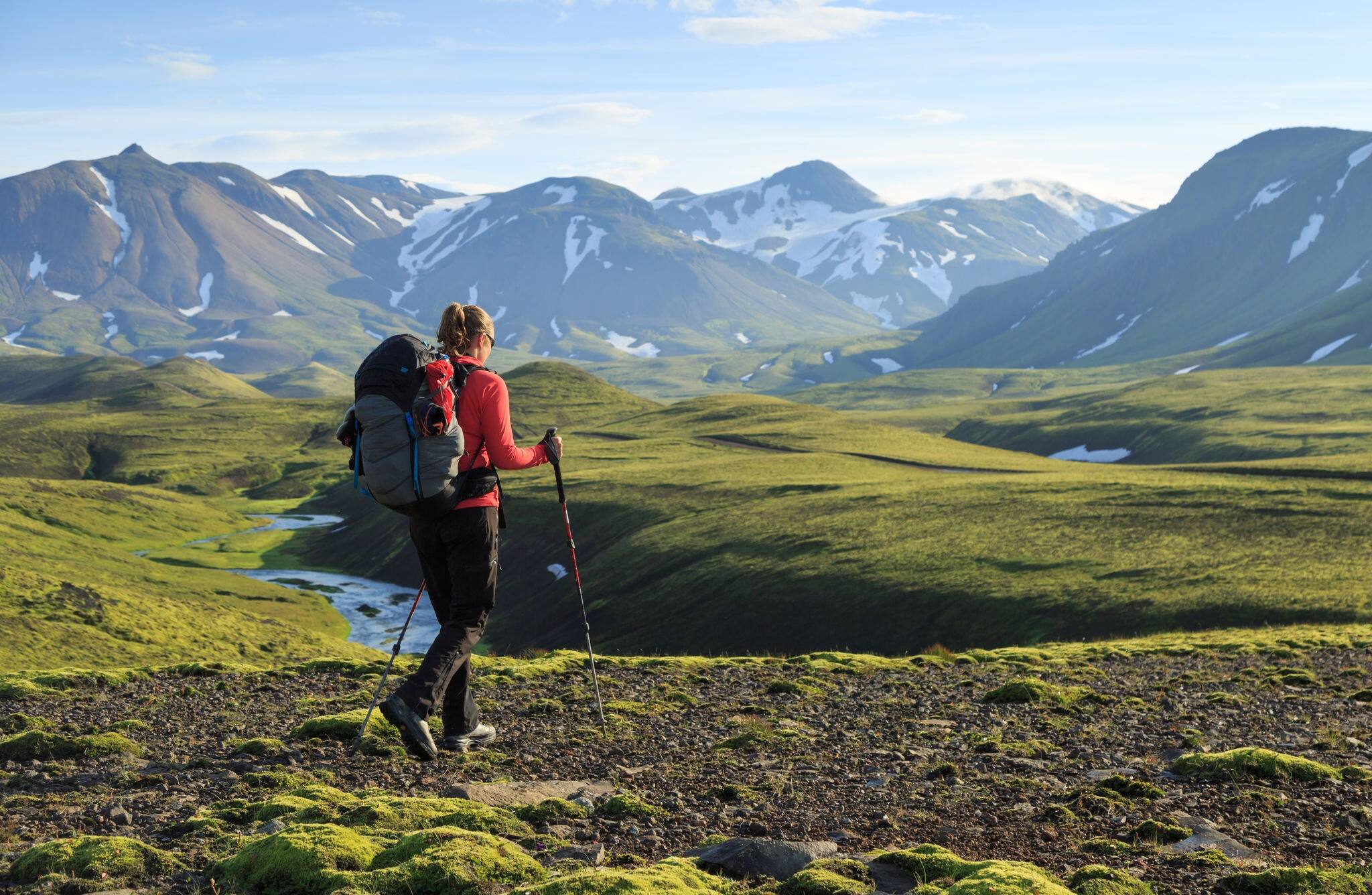 Female hiker enjoying the landscape of Iceland while hiking the Laugavegur trail.