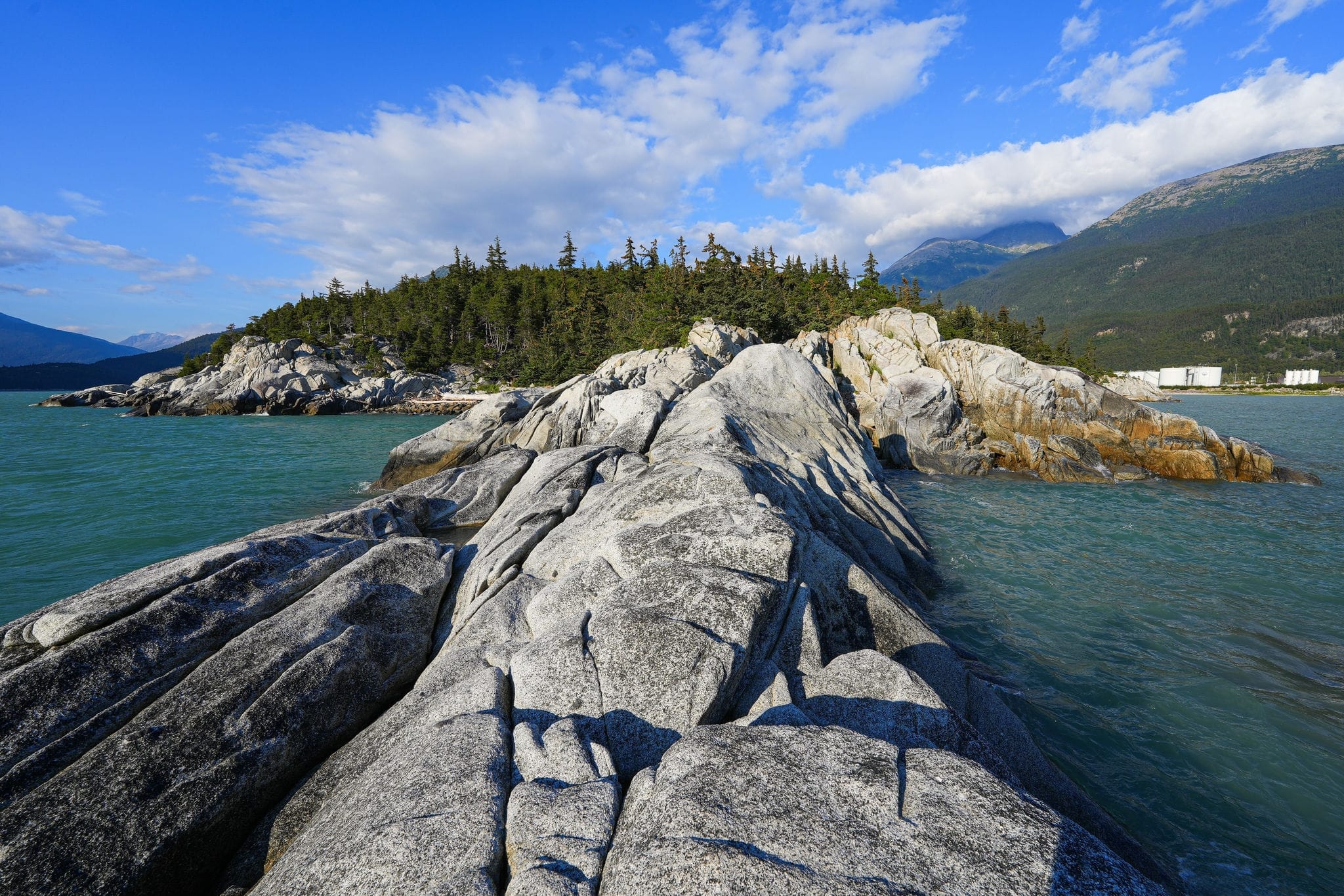 Rocky coastline of Yakutania Point along the shores of the Taiya Inlet in the Pacific Ocean near Skagway, Alaska
