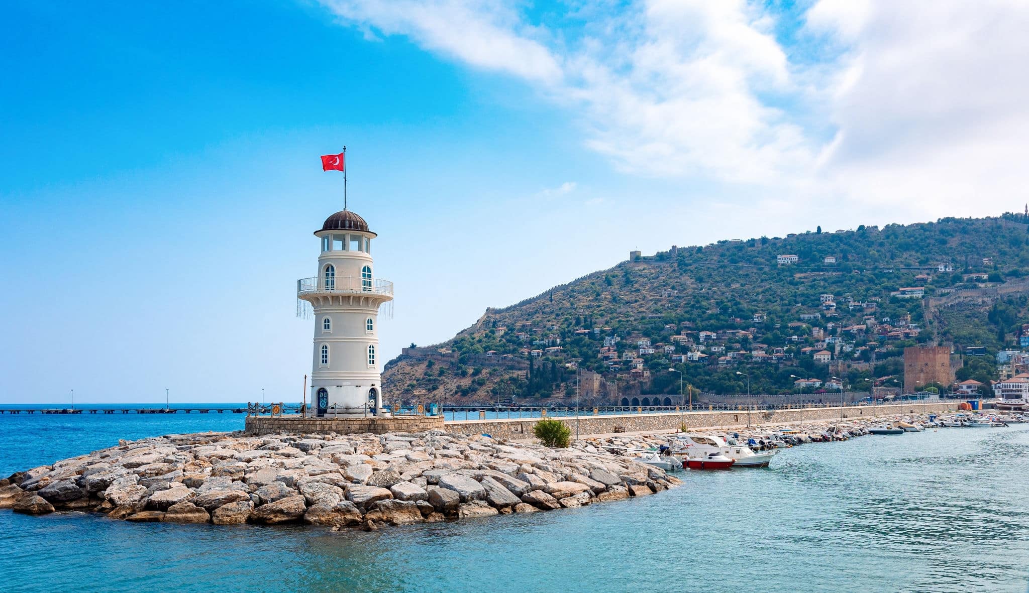 Panoramic view of old lighthouse in Alanya port. Landscape view of Mediterranean coast, Alanya, Turkey. High quality photo