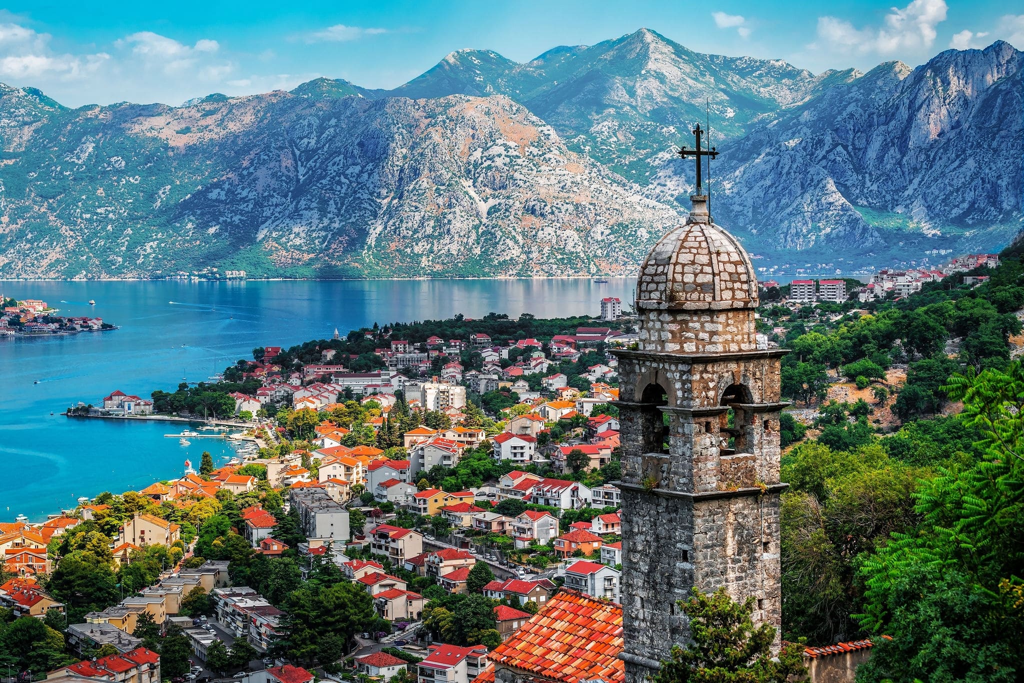 Bell tower of Church Our Lady of Remedy on the hill tower in the old city of Kotor and the Kotor Bay in Montenegro