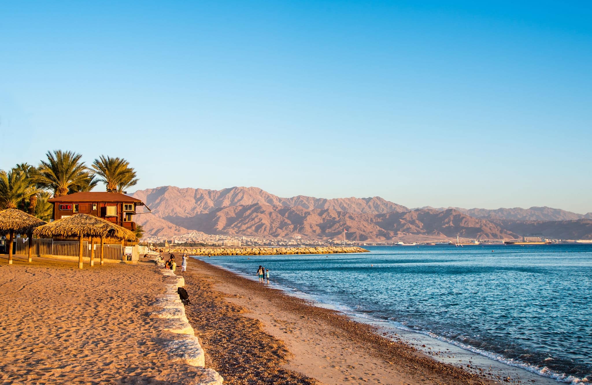 View of Eilat beach, Israel  over  Aqaba city, Jordan.