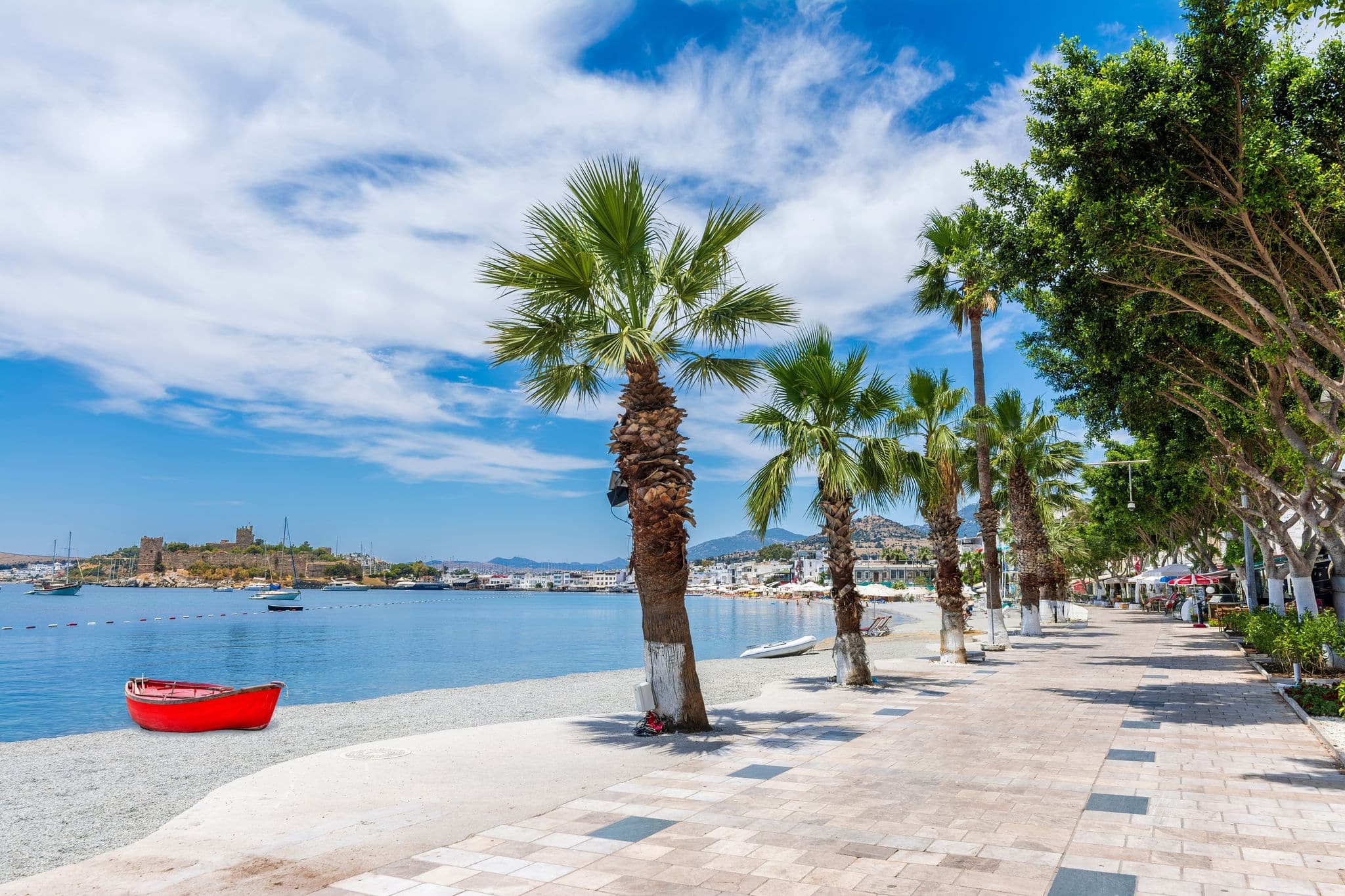 Beach and Bodrum Castle at background view in Bodrum Town. Bodrum is populer tourist destination in Turkey.