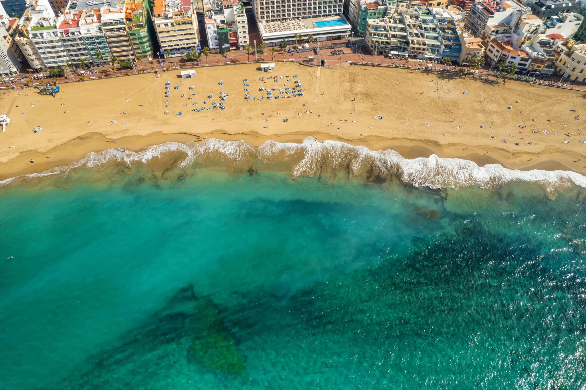 Playa de Las Canteras beach in Las Palmas town, Gran Canaria, Spain. Aerial view of Las Palmas de Gran Canaria, the capital city of the Canary Islands.