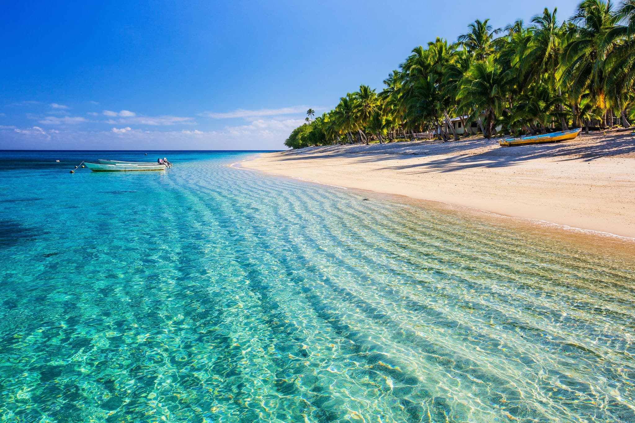Dravuni Island, Fiji. Beach on the tropical islandand clear turquoise water.