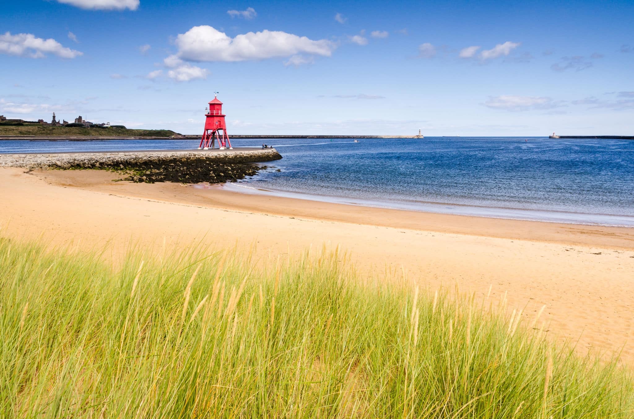 River Tyne beach at South Shields / The Groyne Lighthouse at South Shields sits in the mouth of the River Tyne to protect the beach and help with navigation