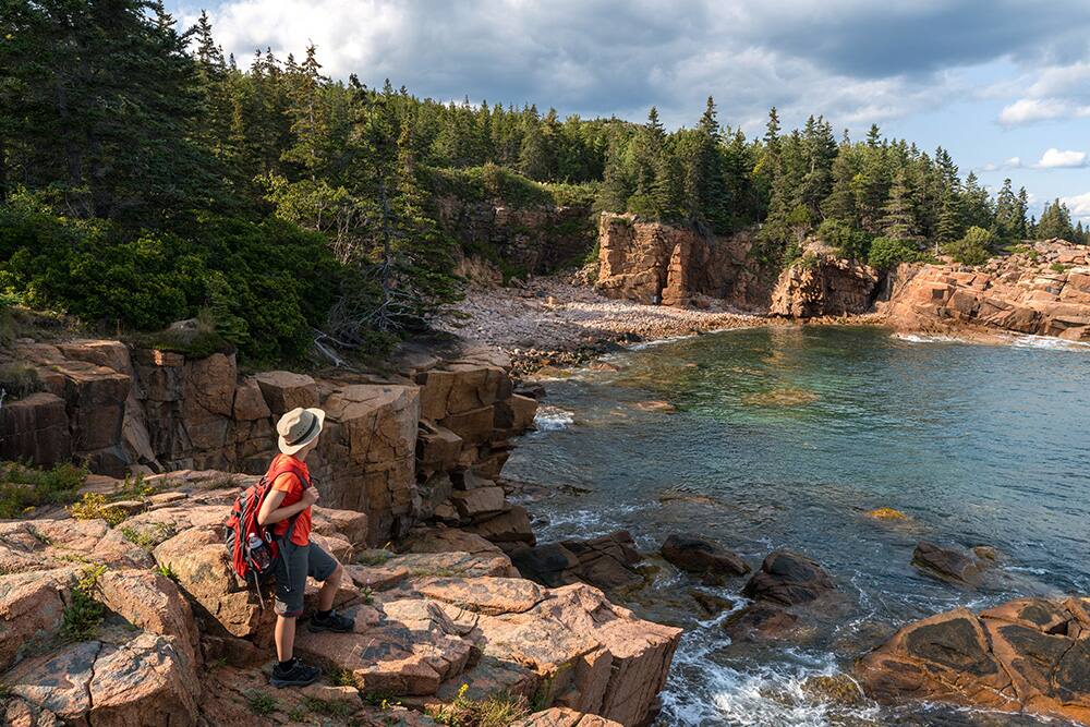 Hiker in Acadia National Park, Canada Hiker in Acadia National Park, Canada