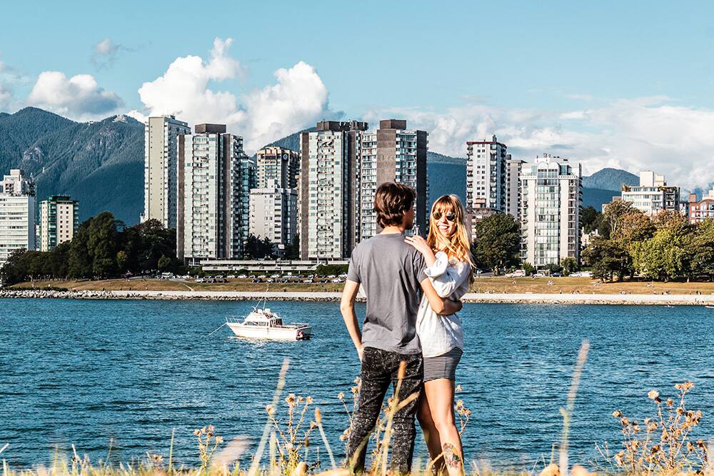 Couple in front of Sunset Beach, Vancouver, BC, Canada