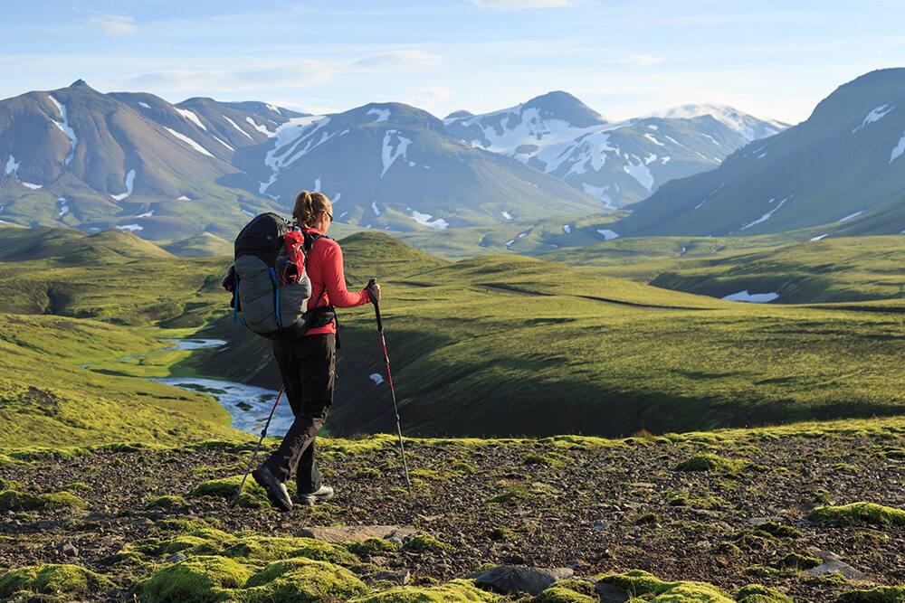 Woman on a hike enjoying the Icelandic landscape Woman on a hike enjoying the Icelandic landscape
