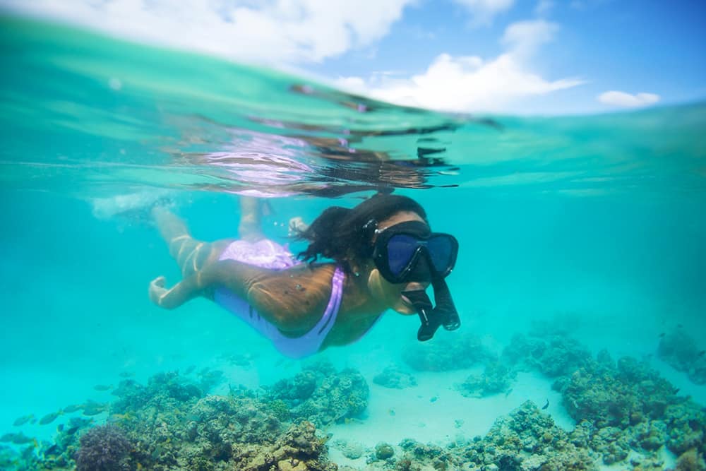 Woman snorkeling near Tahiti