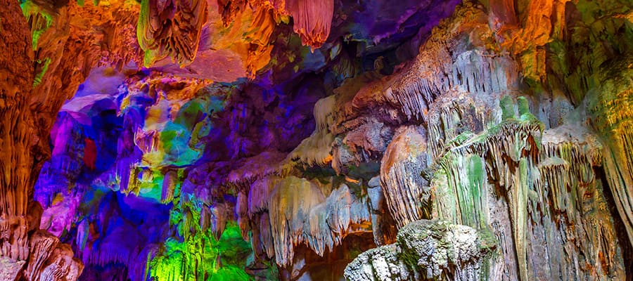 Colourful caves on your Cruise to Hanoi (Ha Long Bay)