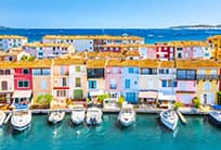 View Of Colorful Houses And Boats In Port Grimaud