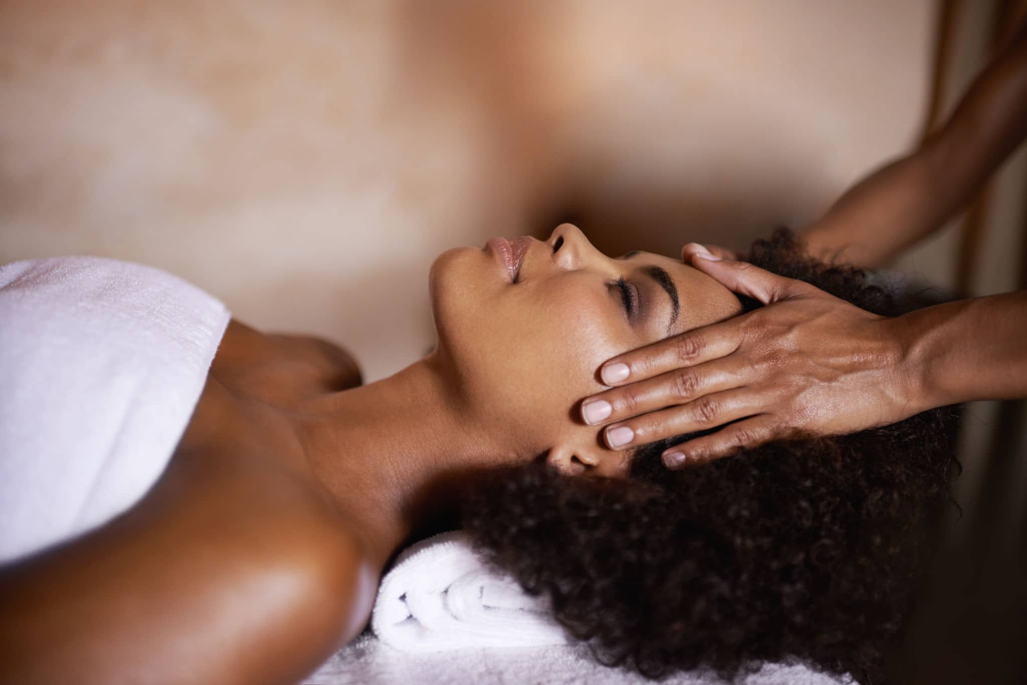 NCL-Hub-Some-well-needed-me-time Shot of a beautiful young woman getting a head massage at a spa