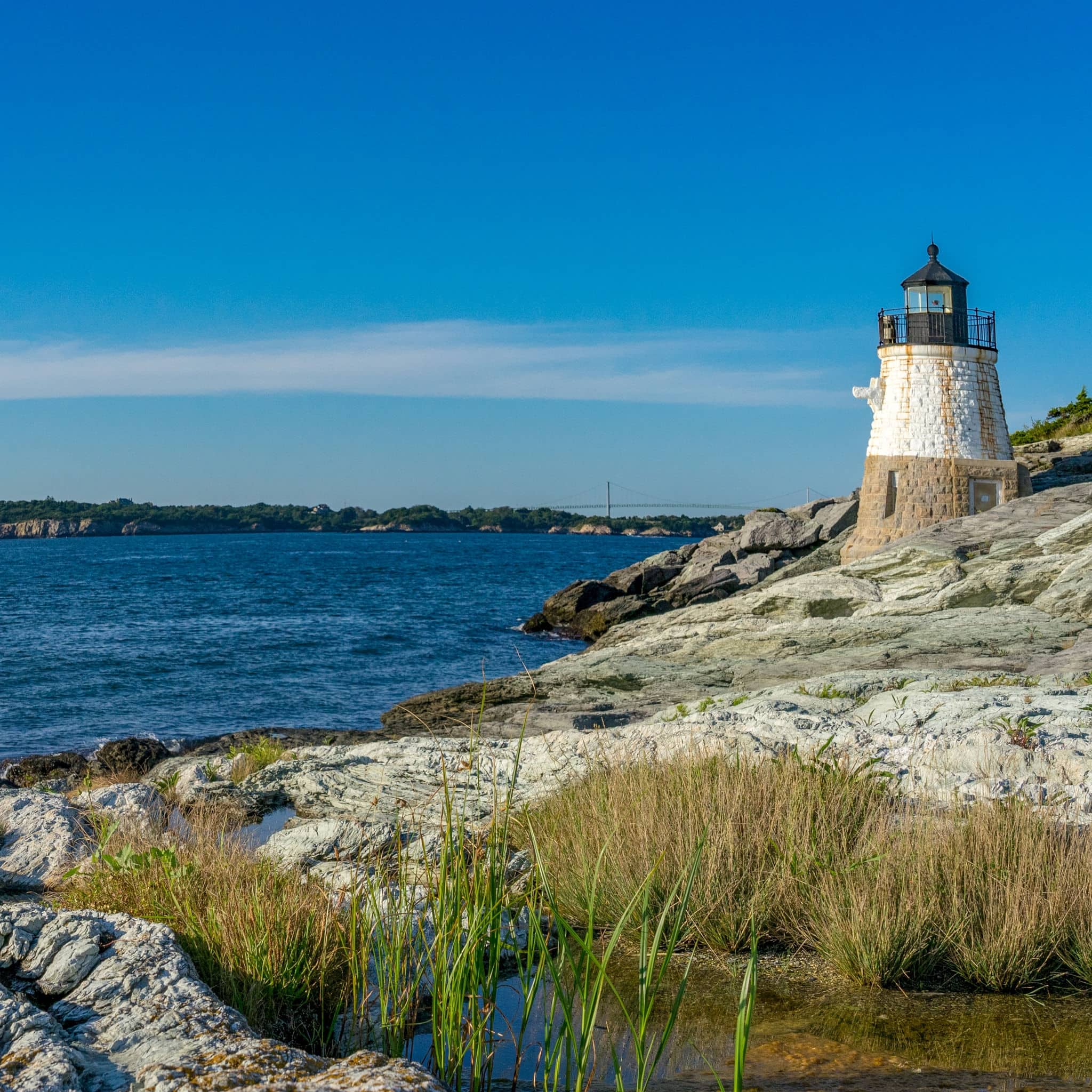 NCL-RhodeIsland-Newport-Cruise-FamousFor-Coastal-Scenery.jpg Beautiful lighthouse overlooking the ocean at sunset, near Newport Rhode Island
