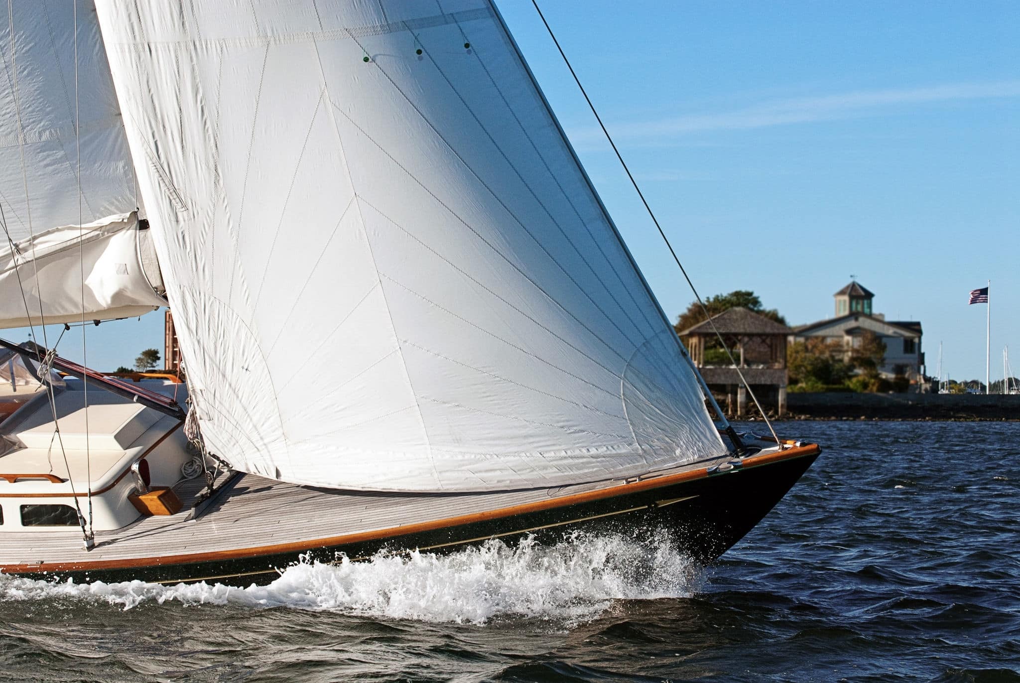 Sailing in Newport Harbor on a windy day in Rhode Island. The Narragansett Bay region is a world class destination for tourists who enjoy sailing. It is known as the sailing capital of the world.