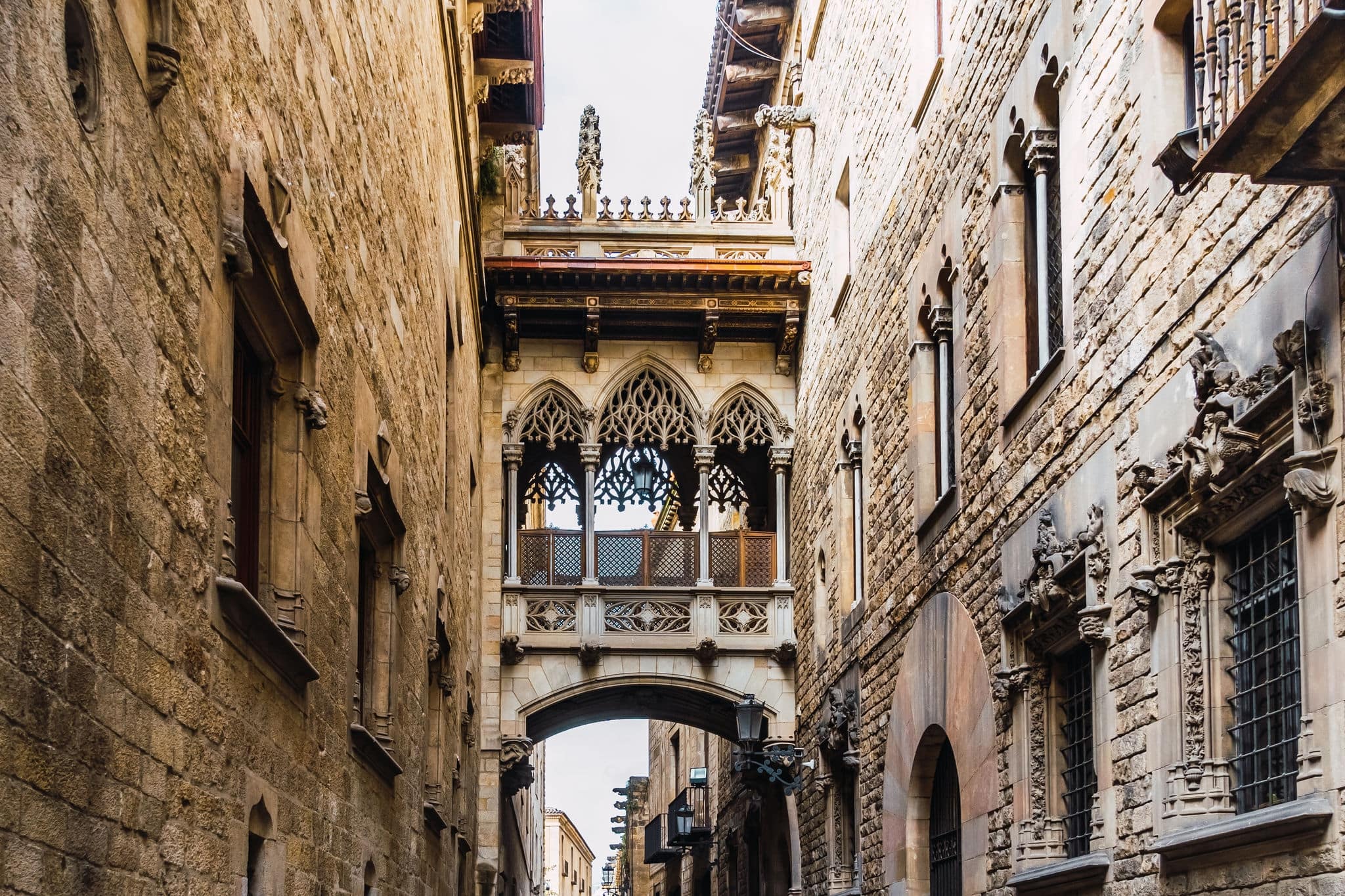 1945727965 View to the Bishop's Bridge in the Gothic Quarter of Barcelona, Catalonia, Spain